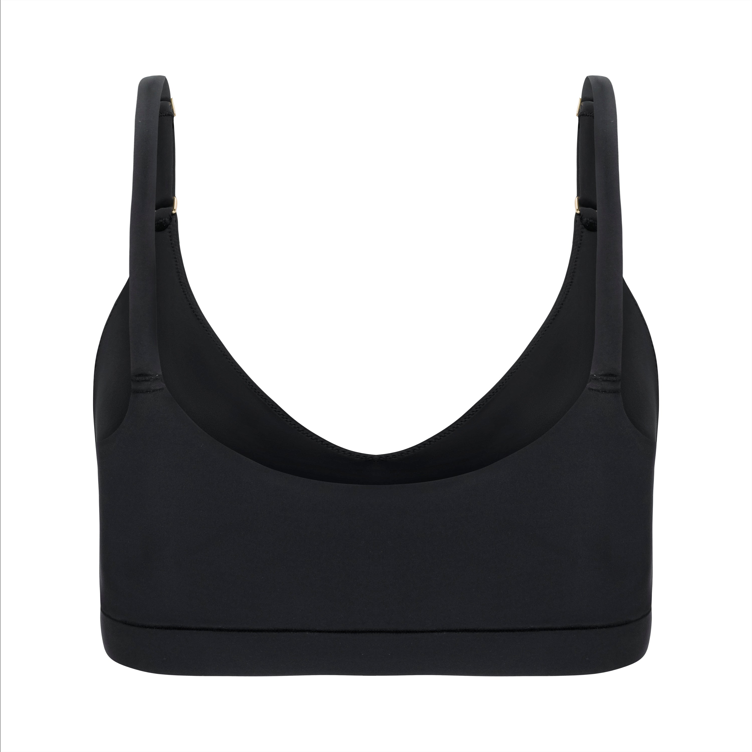 A Tap Shoe Black underwire-free soft bra with adjustable straps and removable cup inserts on white background.