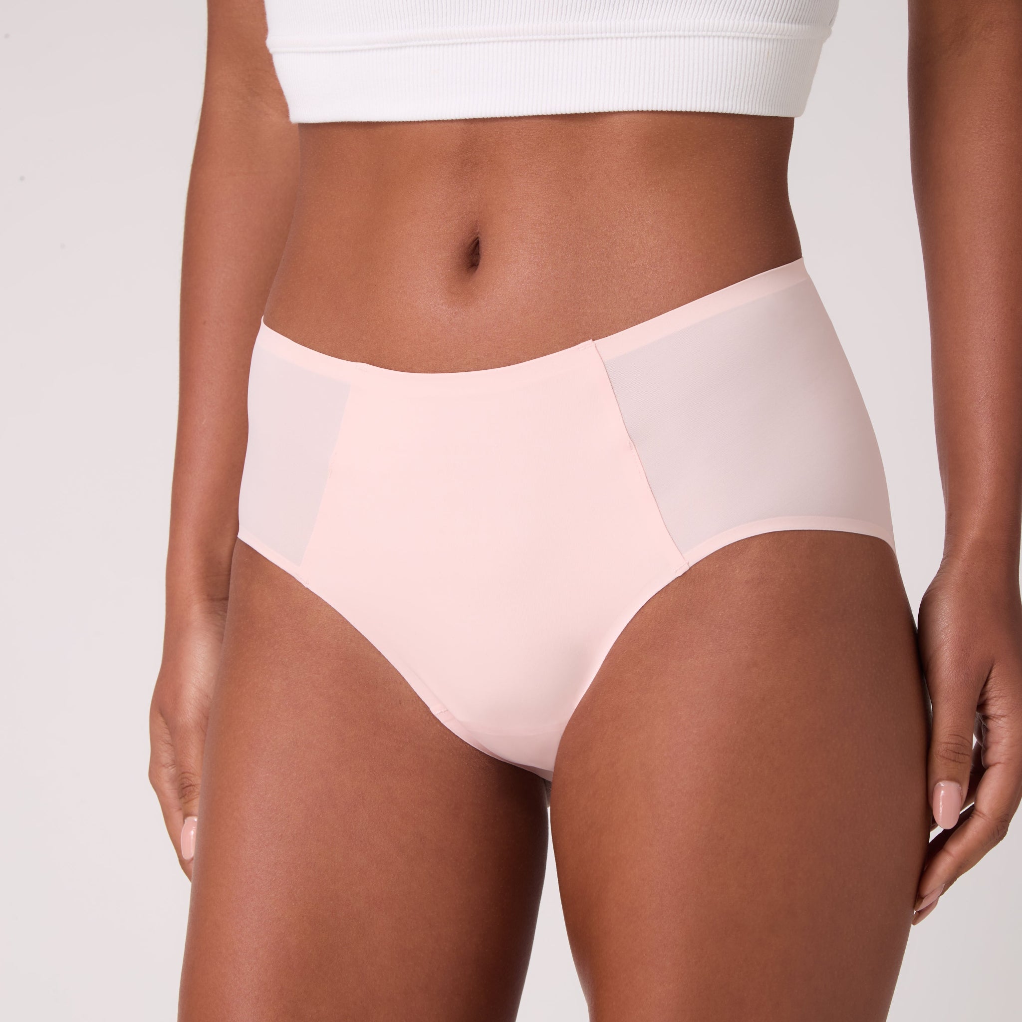 Model wearing Uwila Warrior Soft Seamless High Waisted Brief in Rose Quartz