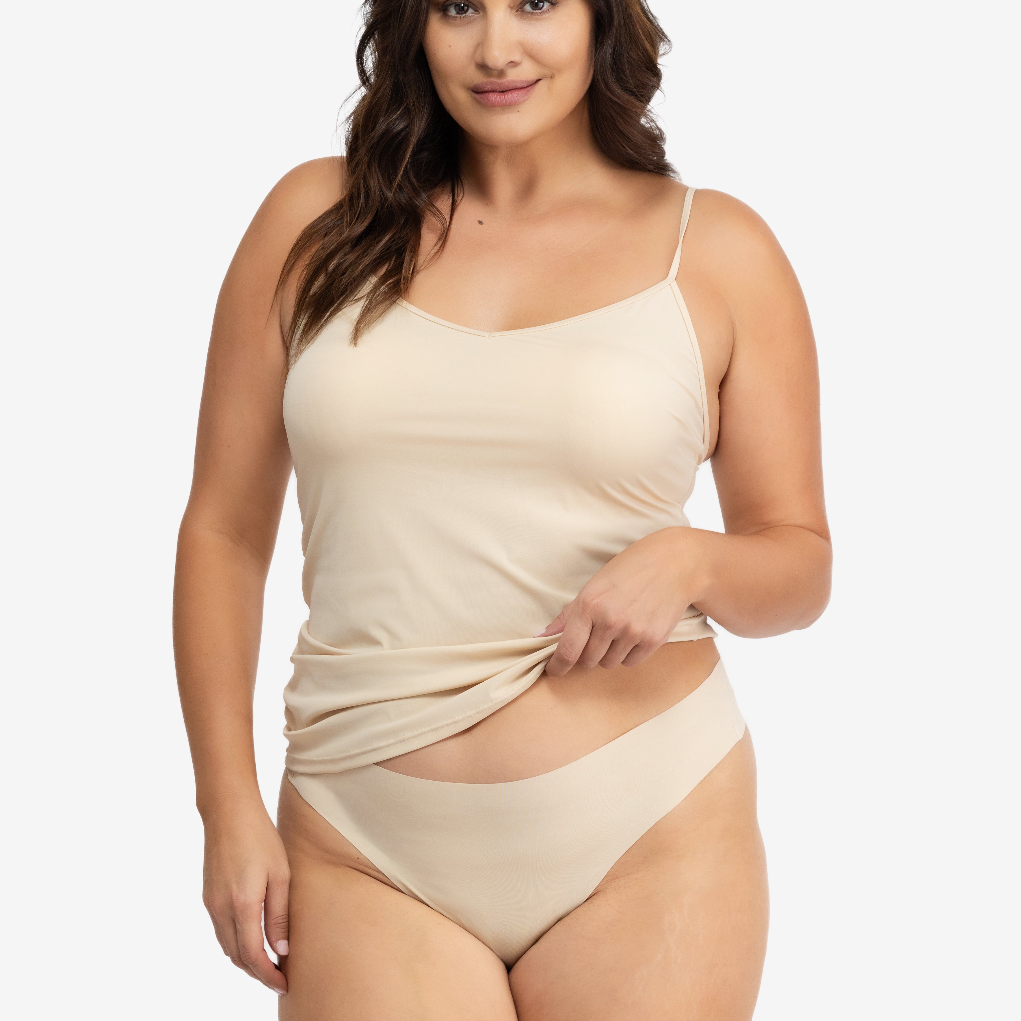 Woman wearing a Smoke Grey soft seamless camisole with adjustable spaghetti straps and a V-neckline on white background.