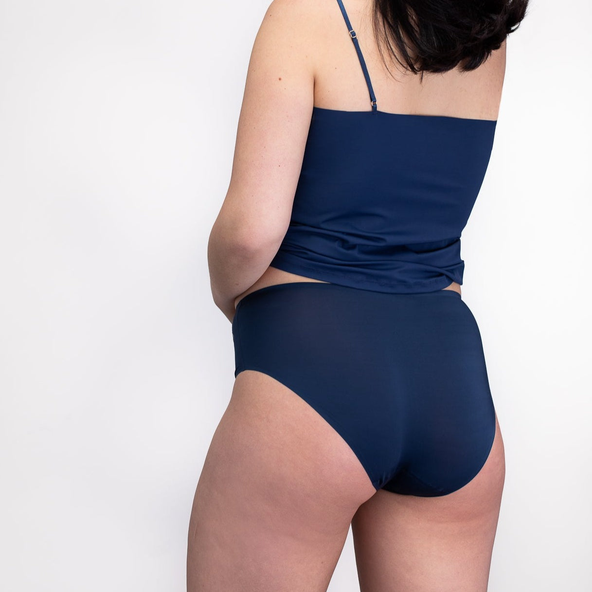 Model wearing the dress blue No-Brainer Brief against a white background
