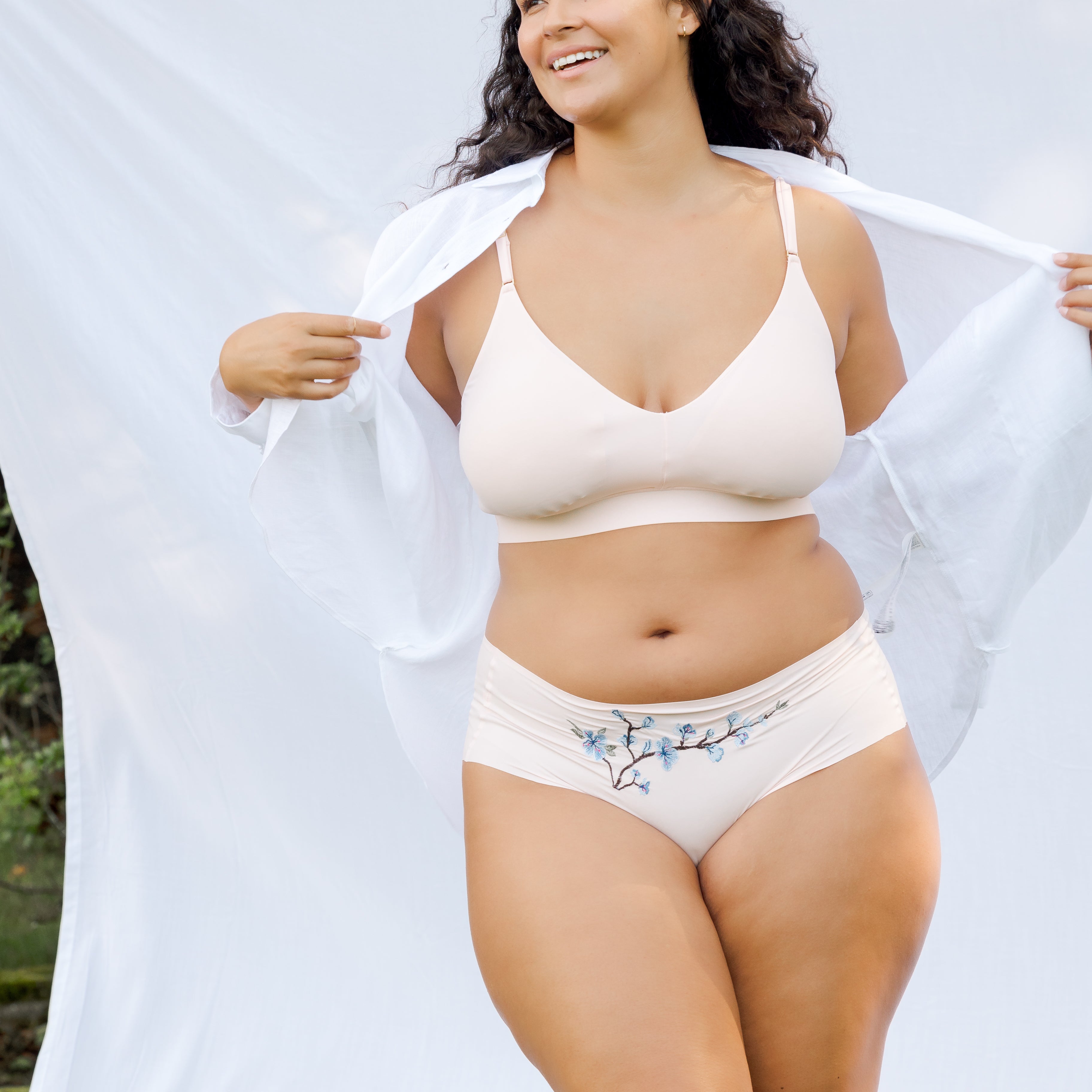 Model wearing Uwila Warrior Better Briefs Soft Bra in Rose Quartz on White Background