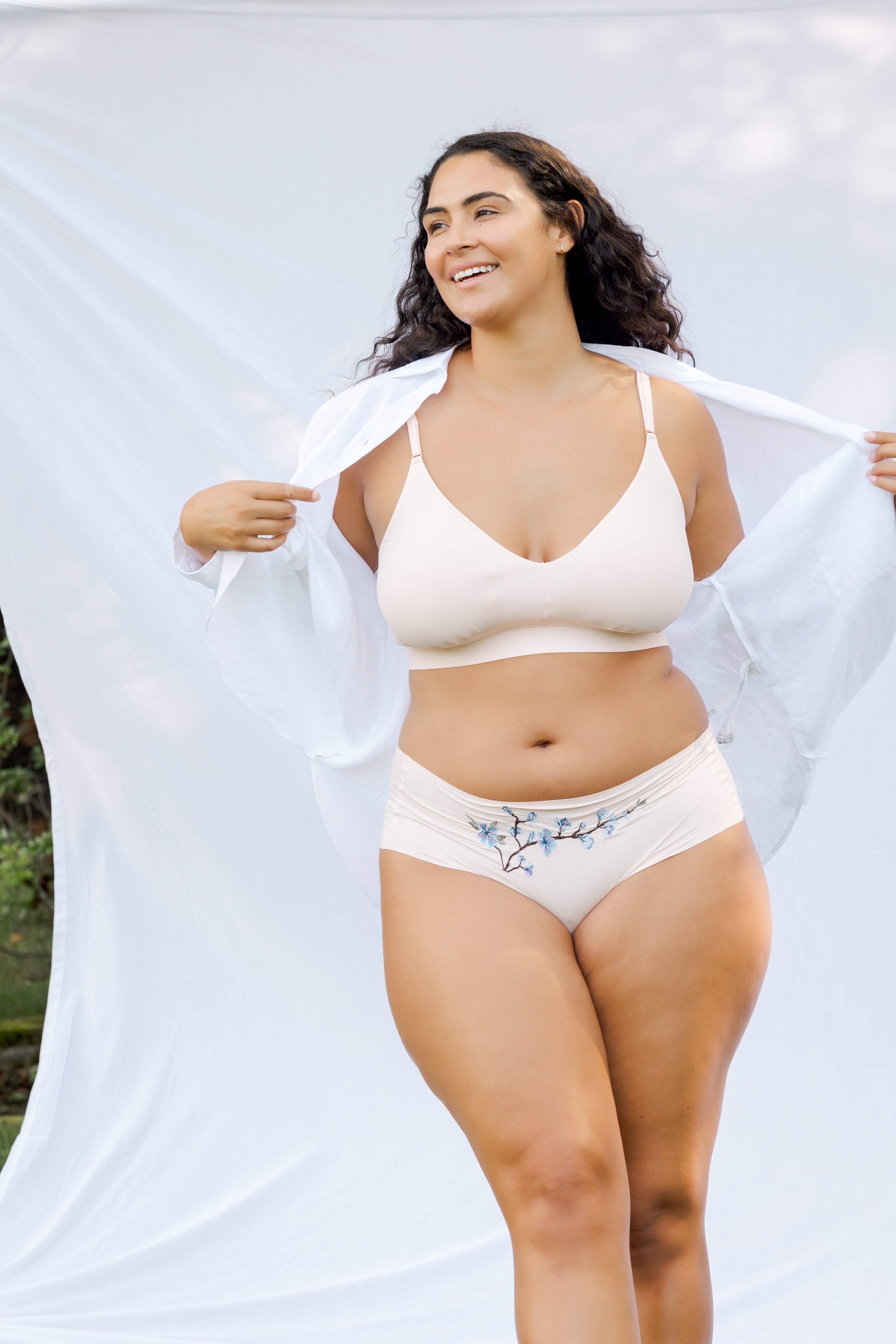 Model wearing Uwila Warrior Better Briefs Soft Bra in Rose Quartz on White Background