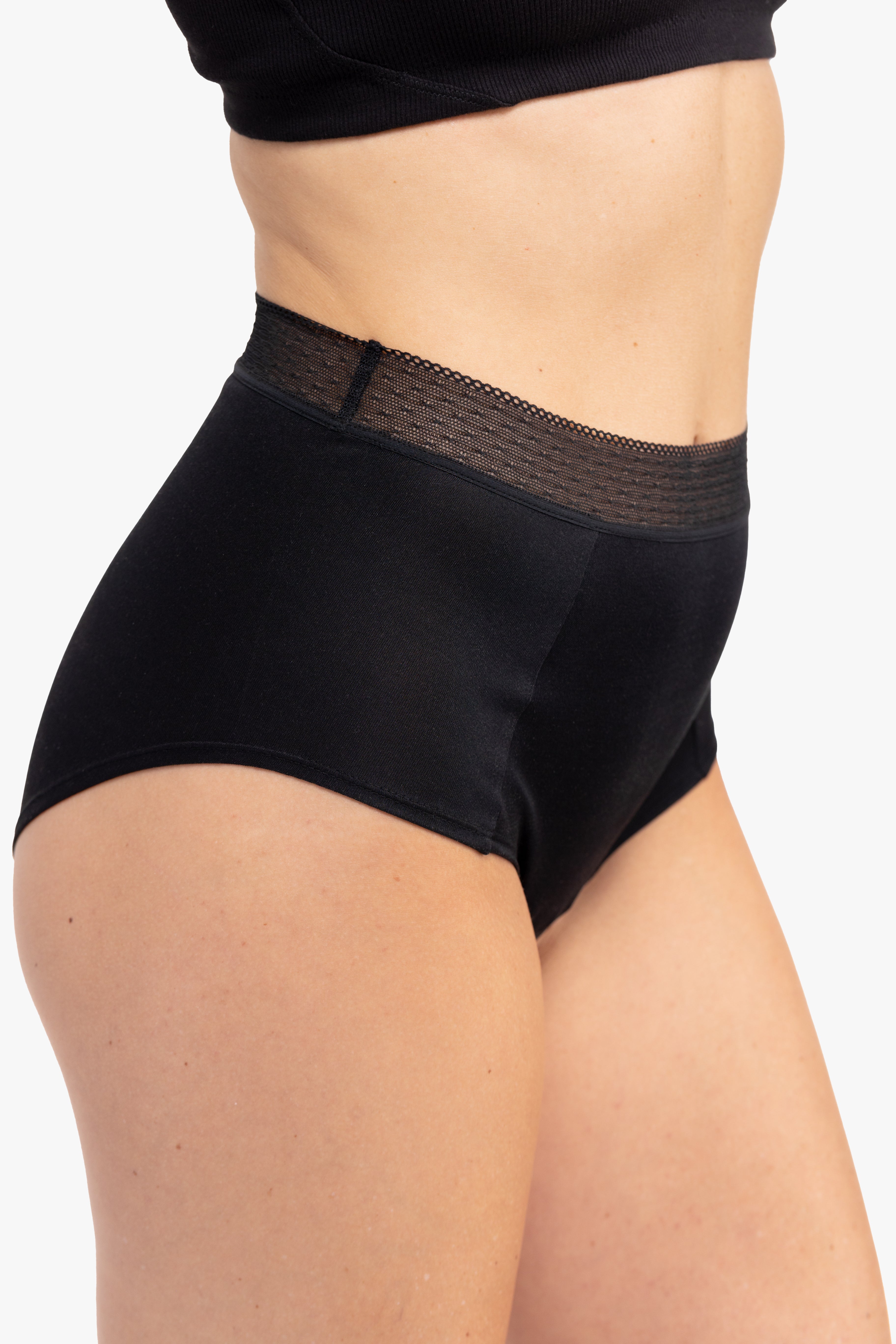 Model Wearing Uwila Warrior HIgh-Waist Silk Briefs Underwear in Tap Shoe Black on White Background