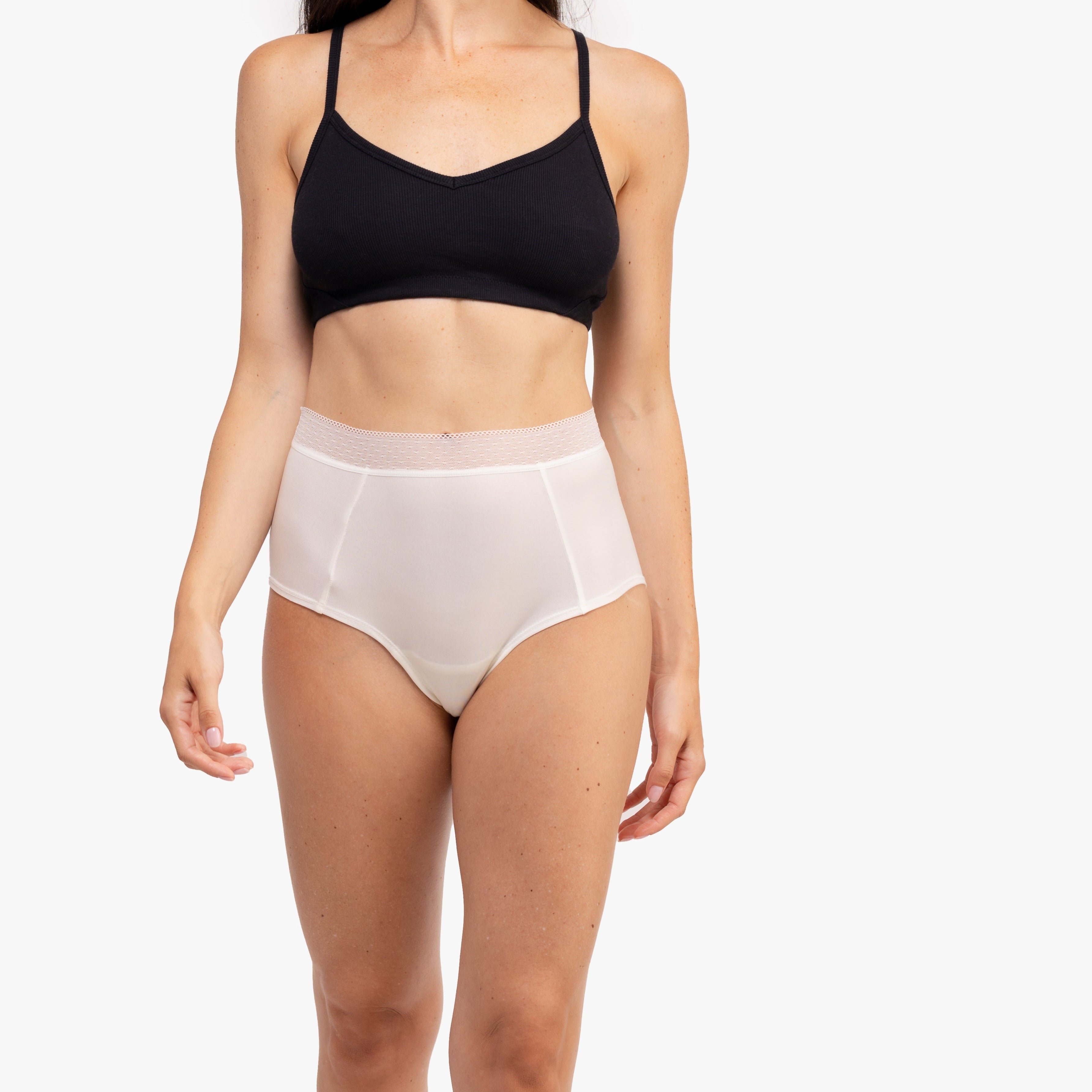 Model Wearing Uwila Warrior HIgh-Waist Silk Briefs Underwear in Winter White on White Background