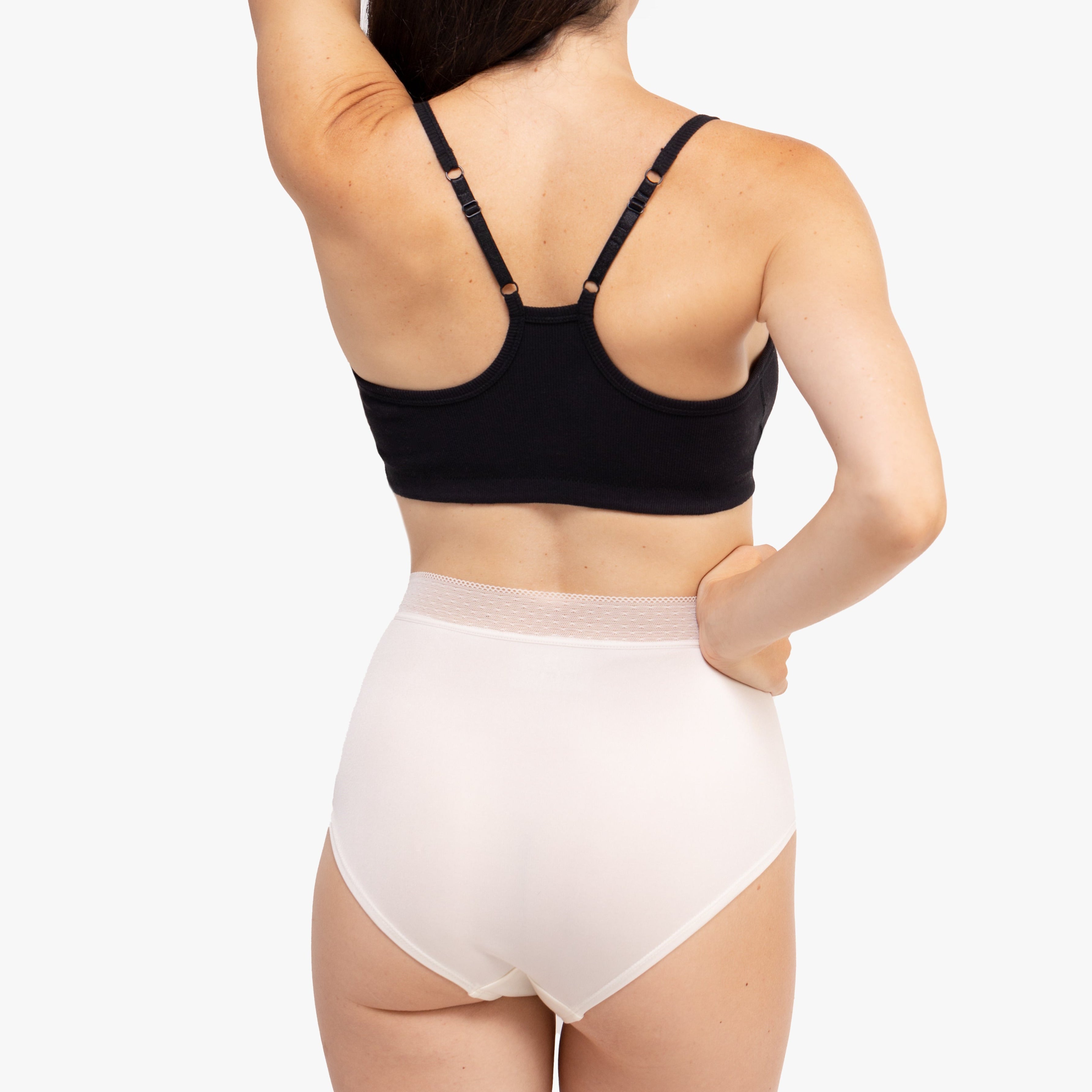 Model Wearing Uwila Warrior HIgh-Waist Silk Briefs Underwear in Winter White on White Background