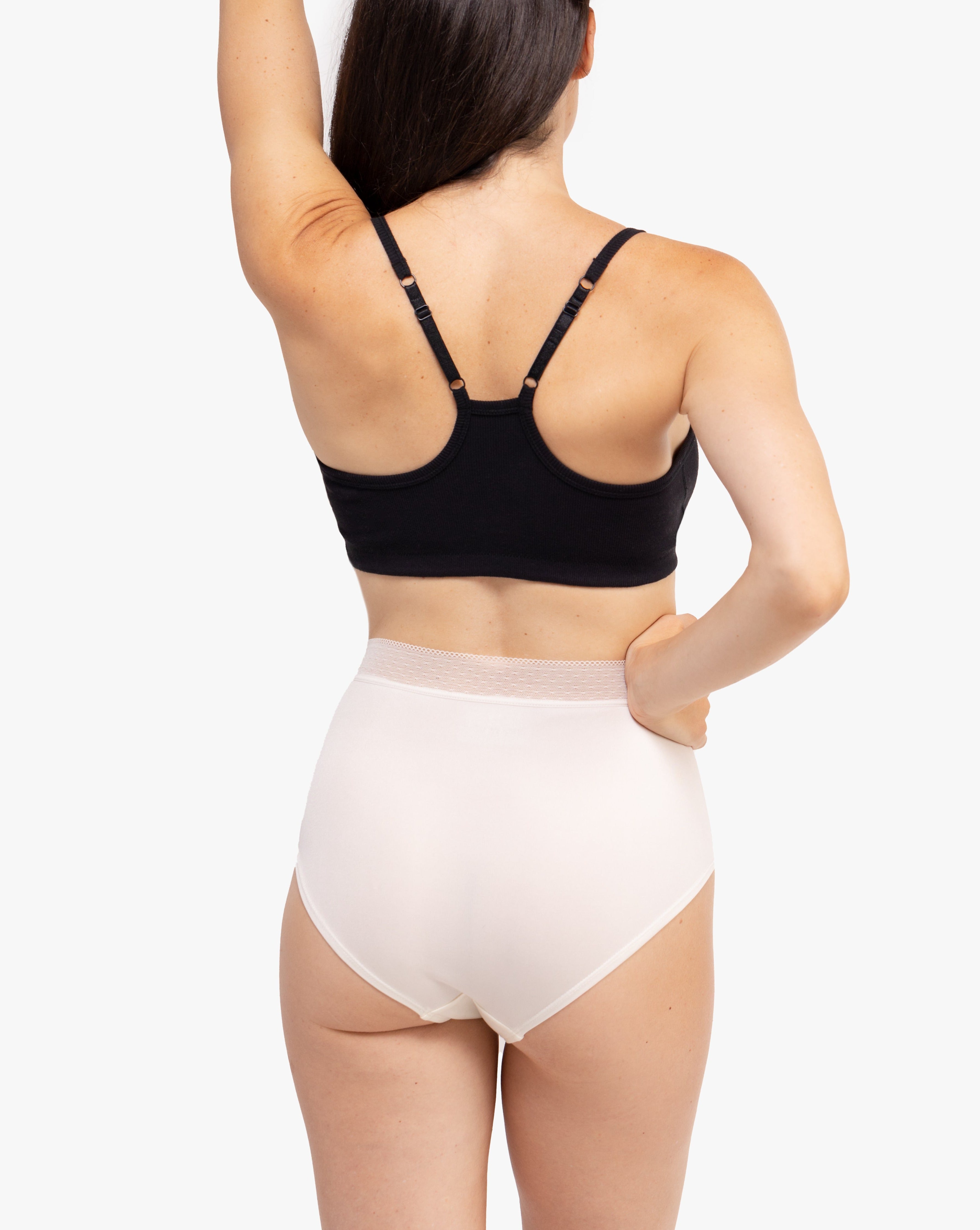 Model Wearing Uwila Warrior HIgh-Waist Silk Briefs Underwear in Winter White on White Background
