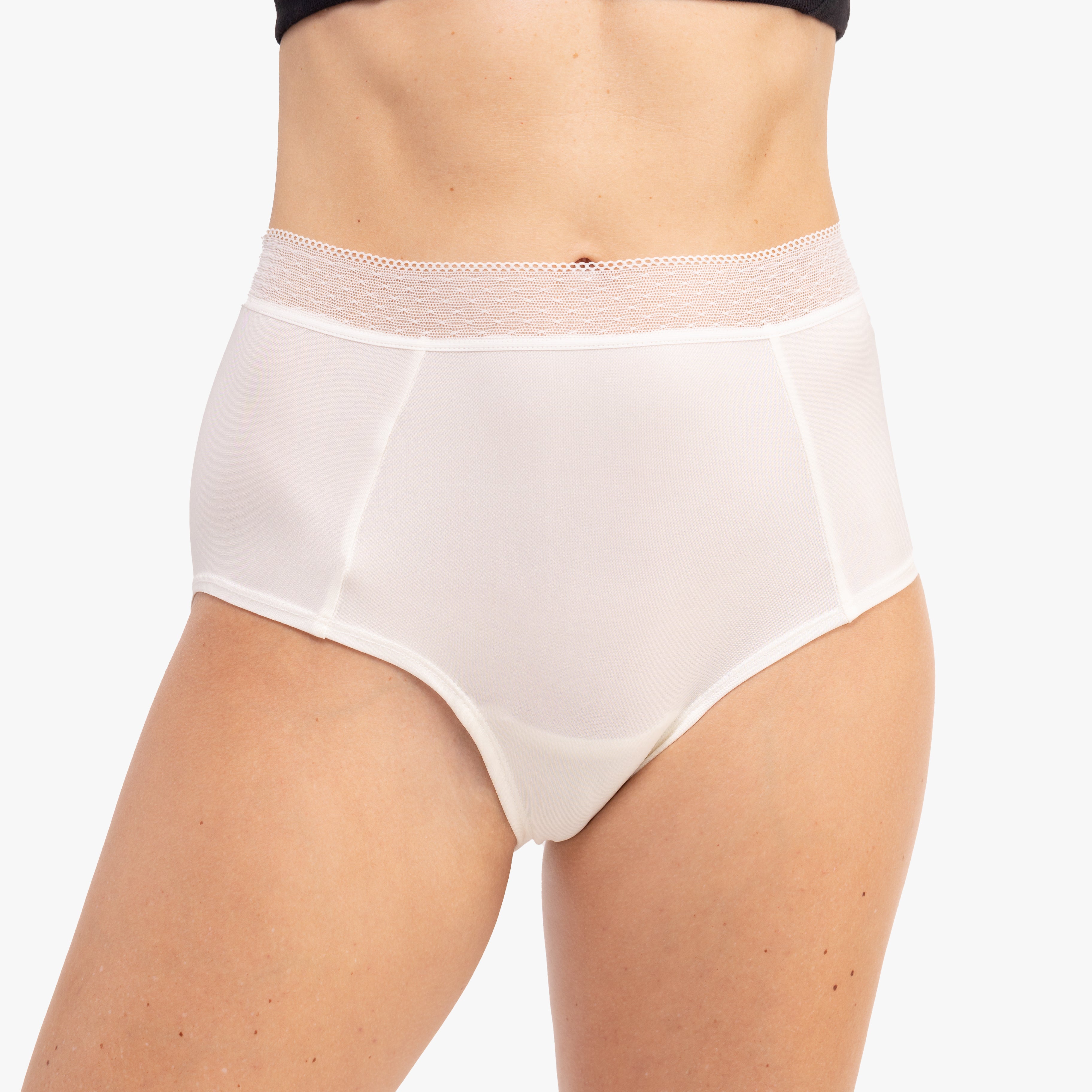 Model Wearing Uwila Warrior HIgh-Waist Silk Briefs Underwear in Winter White on White Background