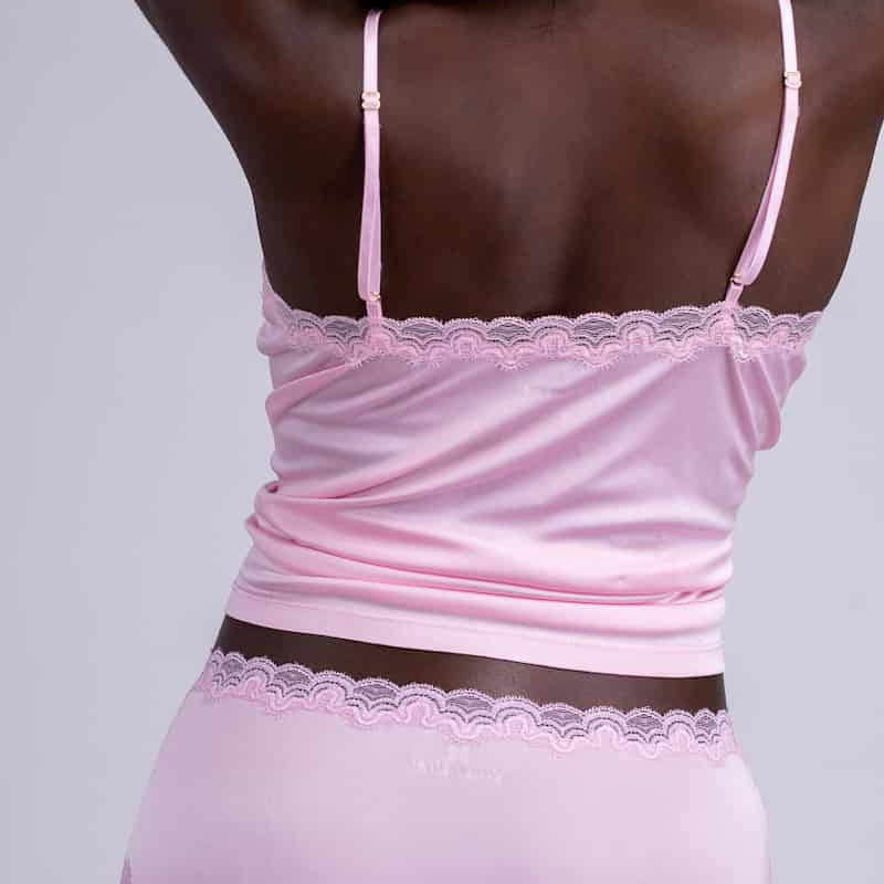 Model wearing Uwila Warrior Soft Silks Camisole in Almond Blossom on White Background