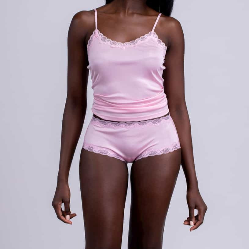 Model wearing Uwila Warrior Soft Silks Camisole in Almond Blossom on White Background