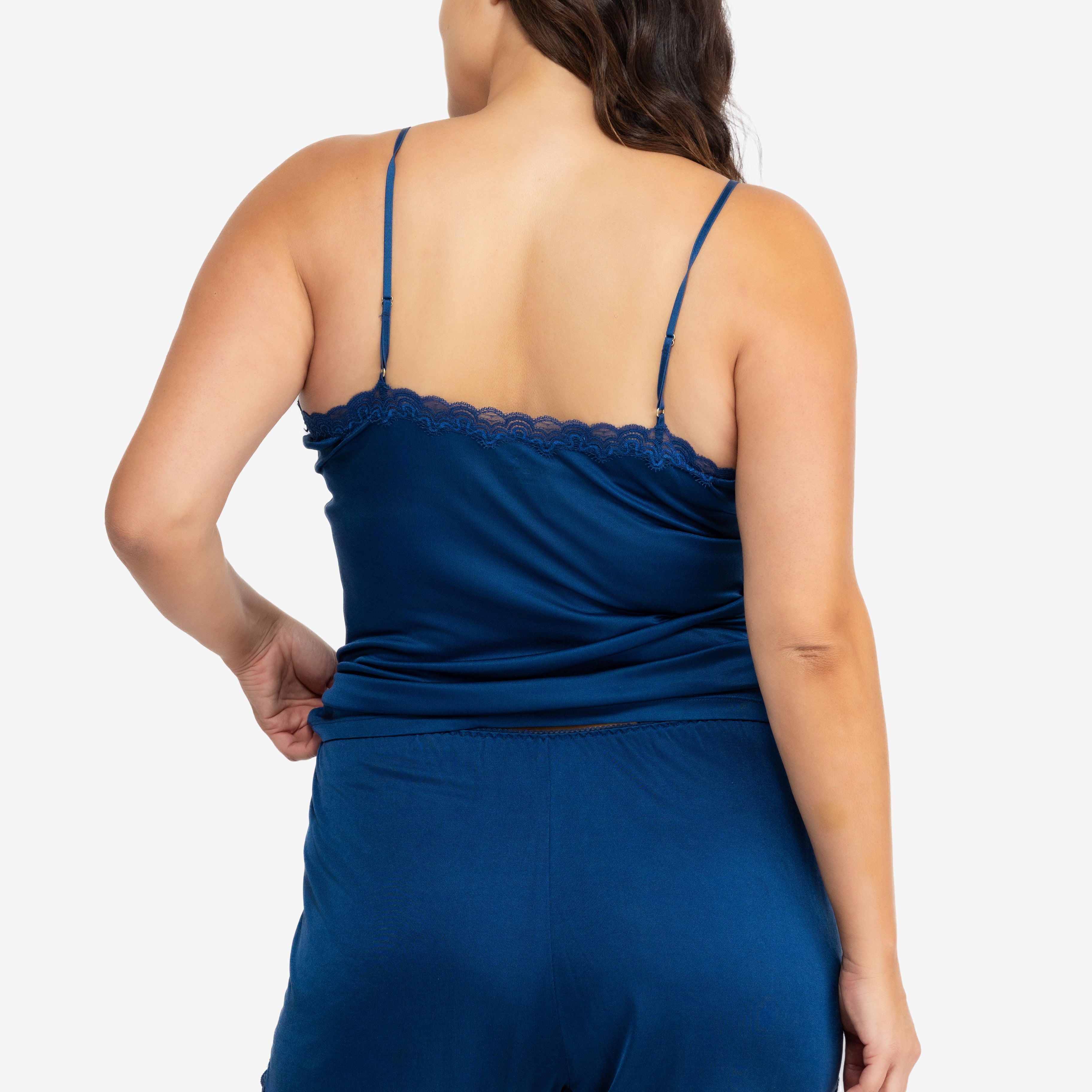 Model wearing Uwila Warrior Soft Silk Sleep Short in Estate Blue on White Background