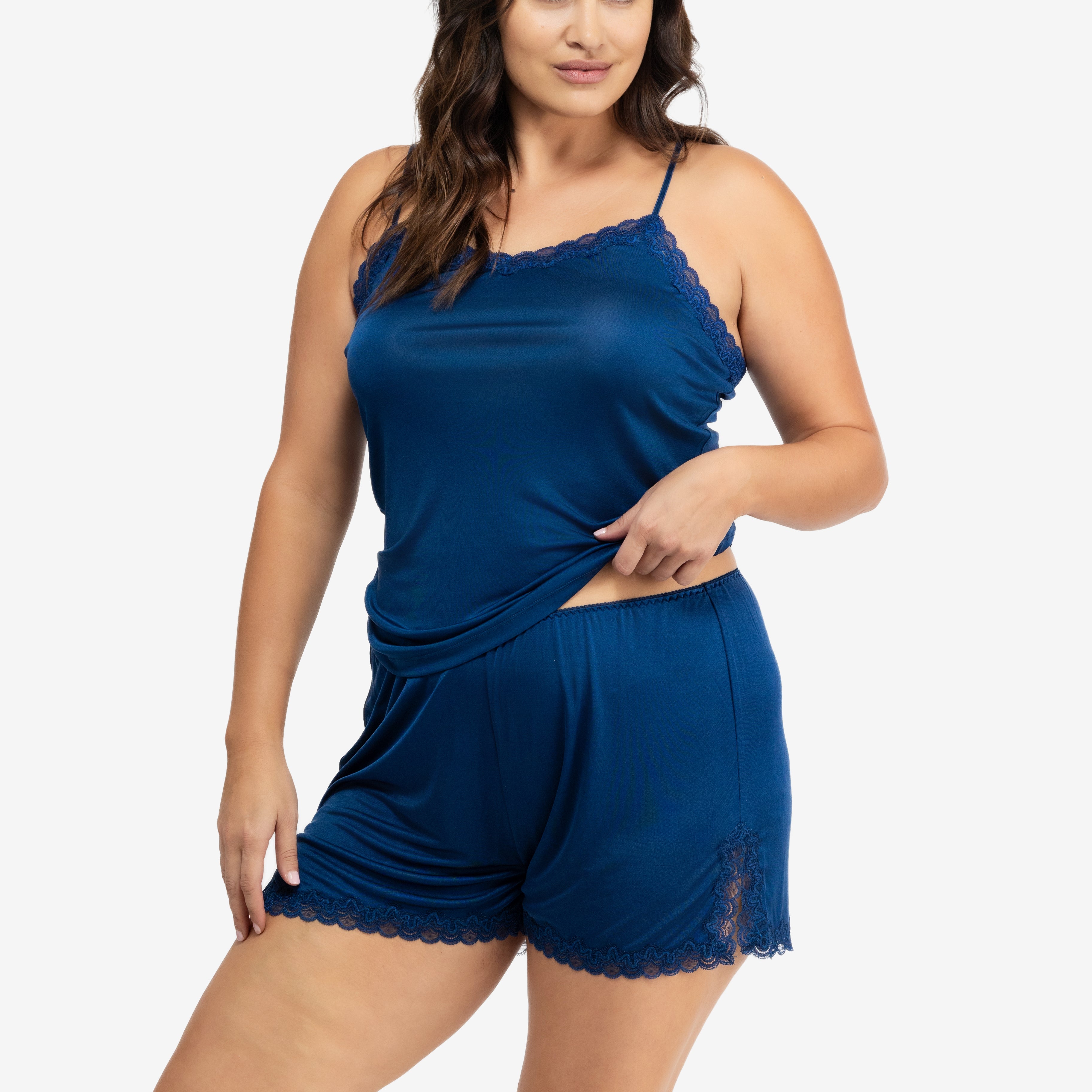Model wearing Uwila Warrior Soft Silk Sleep Short in Estate Blue on White Background