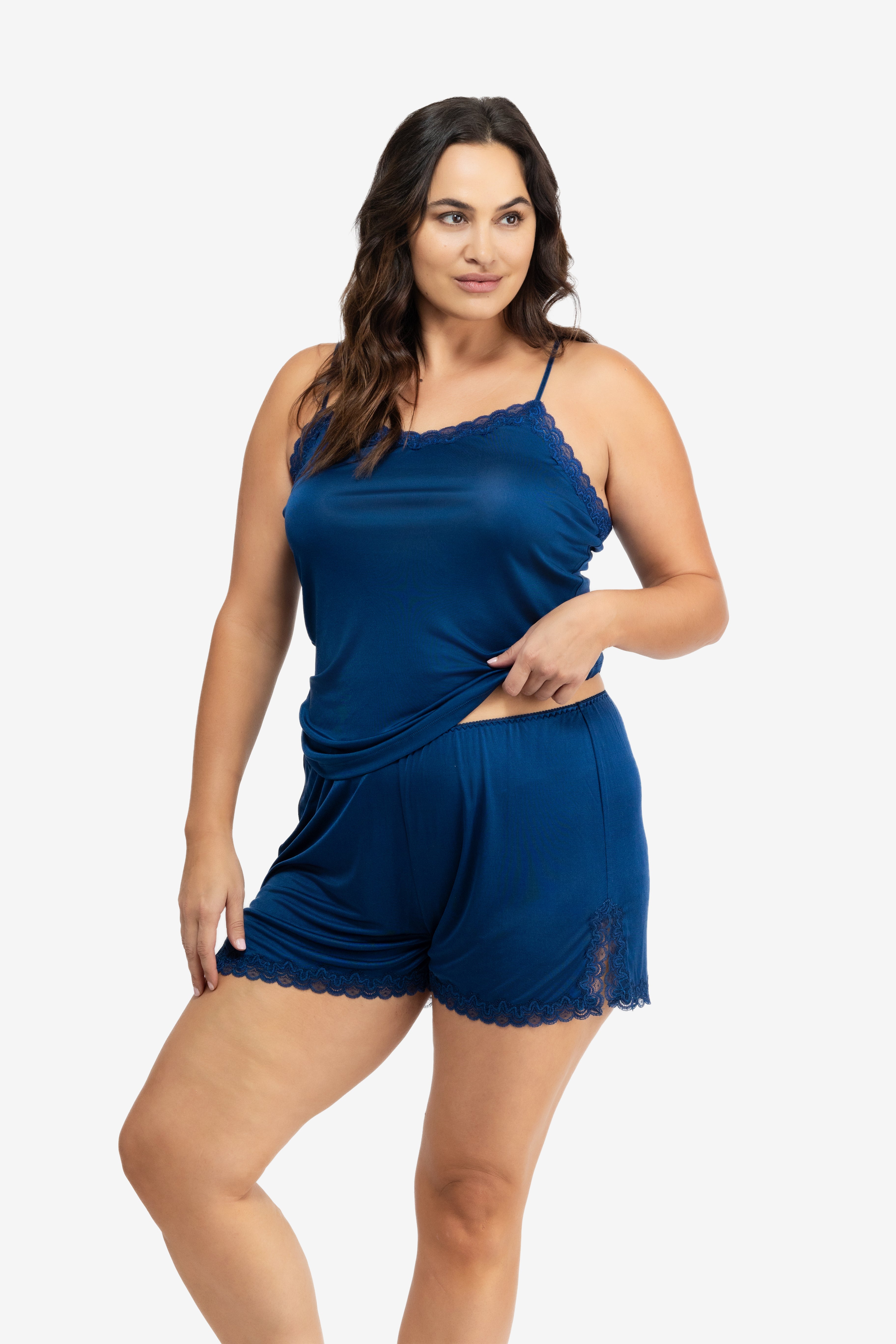 Model wearing Uwila Warrior Soft Silk Sleep Short in Estate Blue on White Background