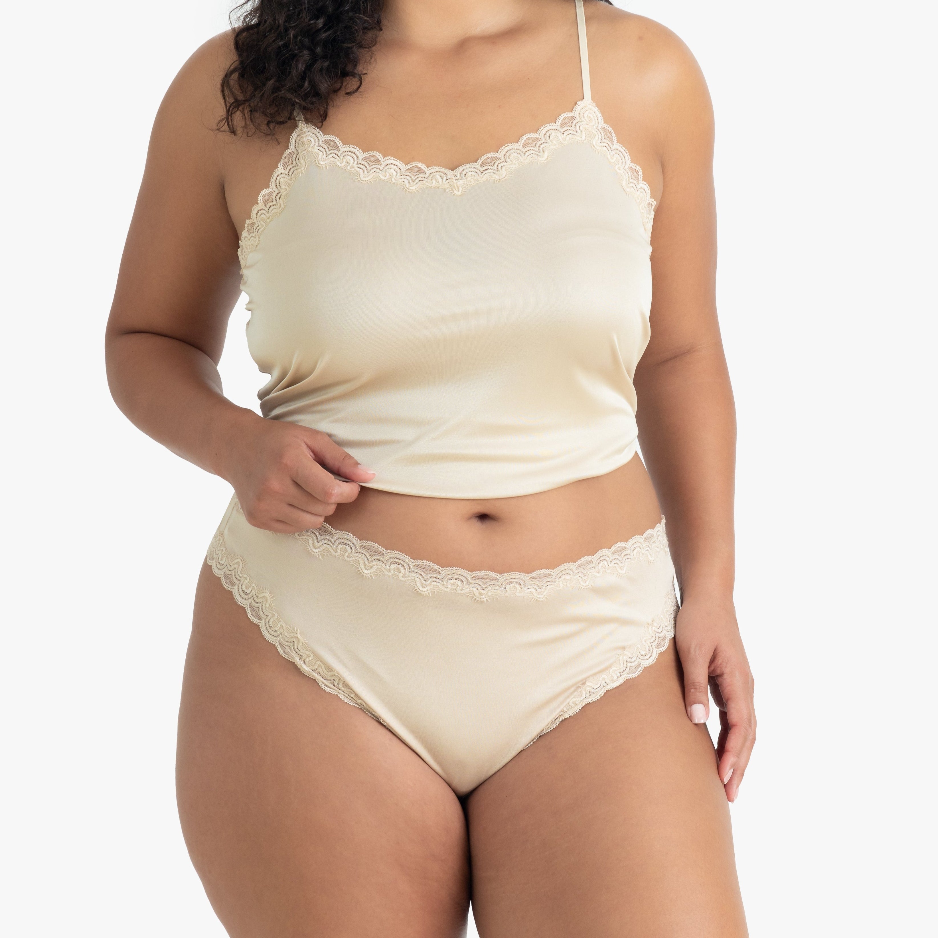 Model wearing Uwila Warrior Soft Silks Thong Underwear in Smoke Grey on White Background