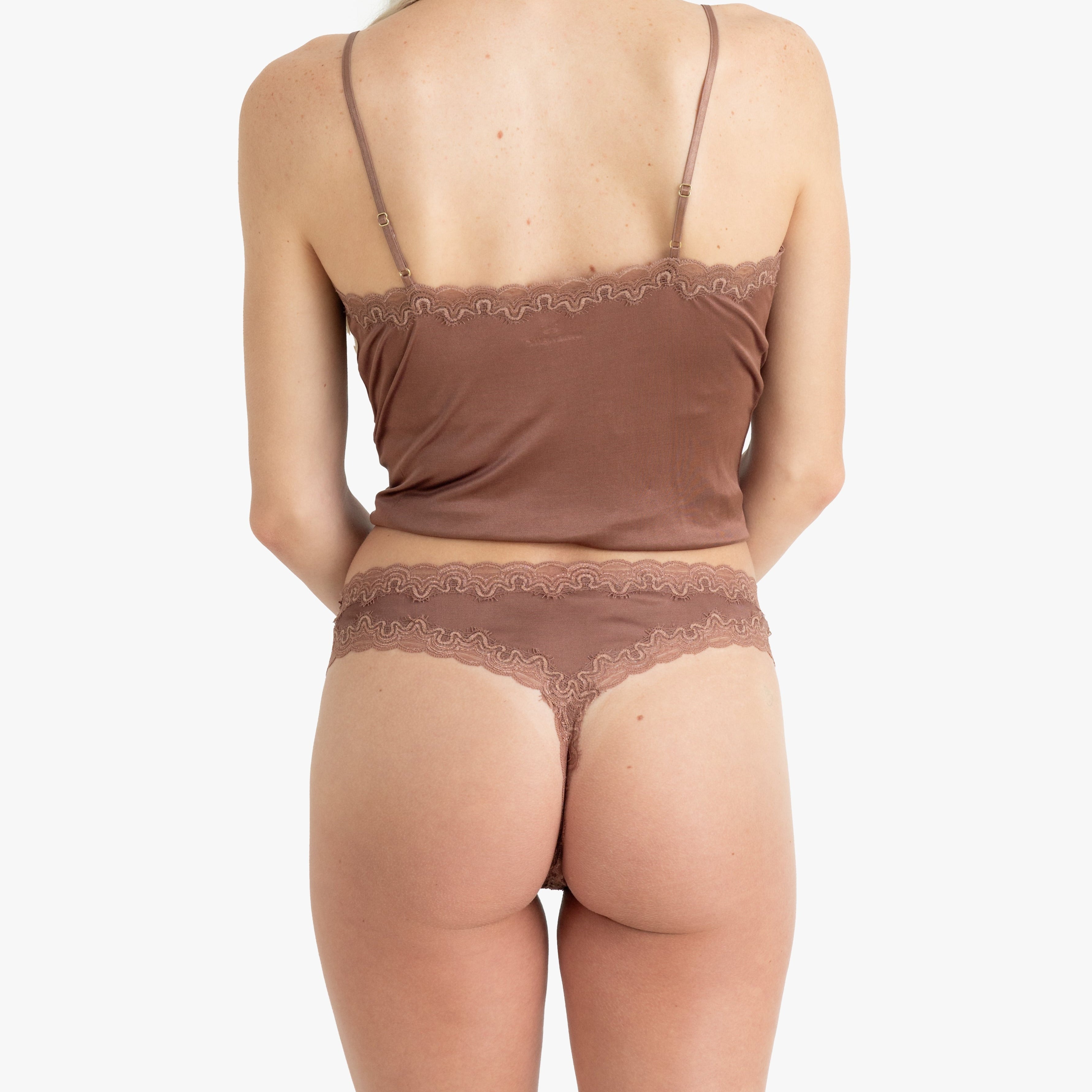 Model wearing Uwila Warrior Soft Silks Thong Underwear in Toffee on White Background