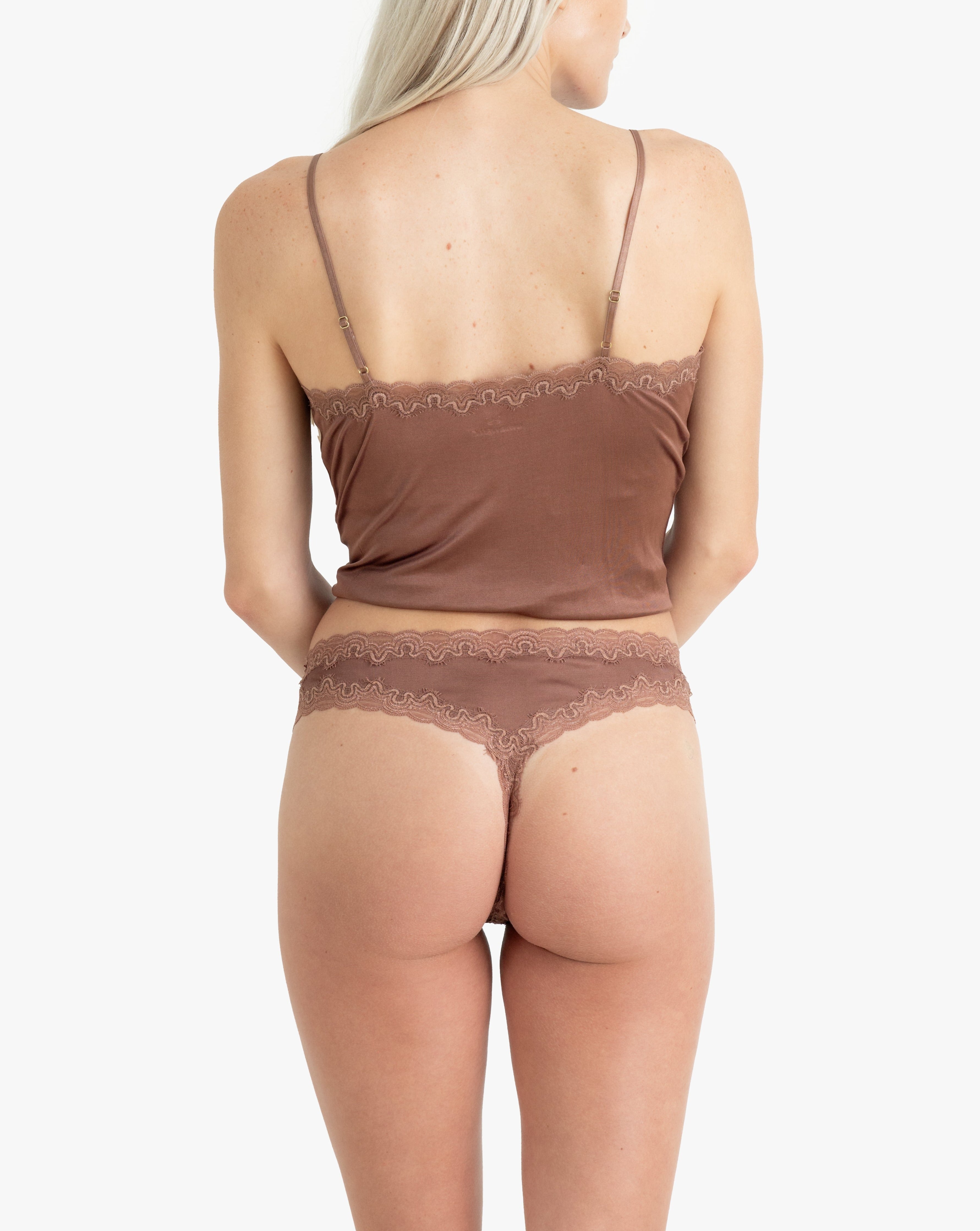 Model wearing Uwila Warrior Soft Silks Thong Underwear in Toffee on White Background