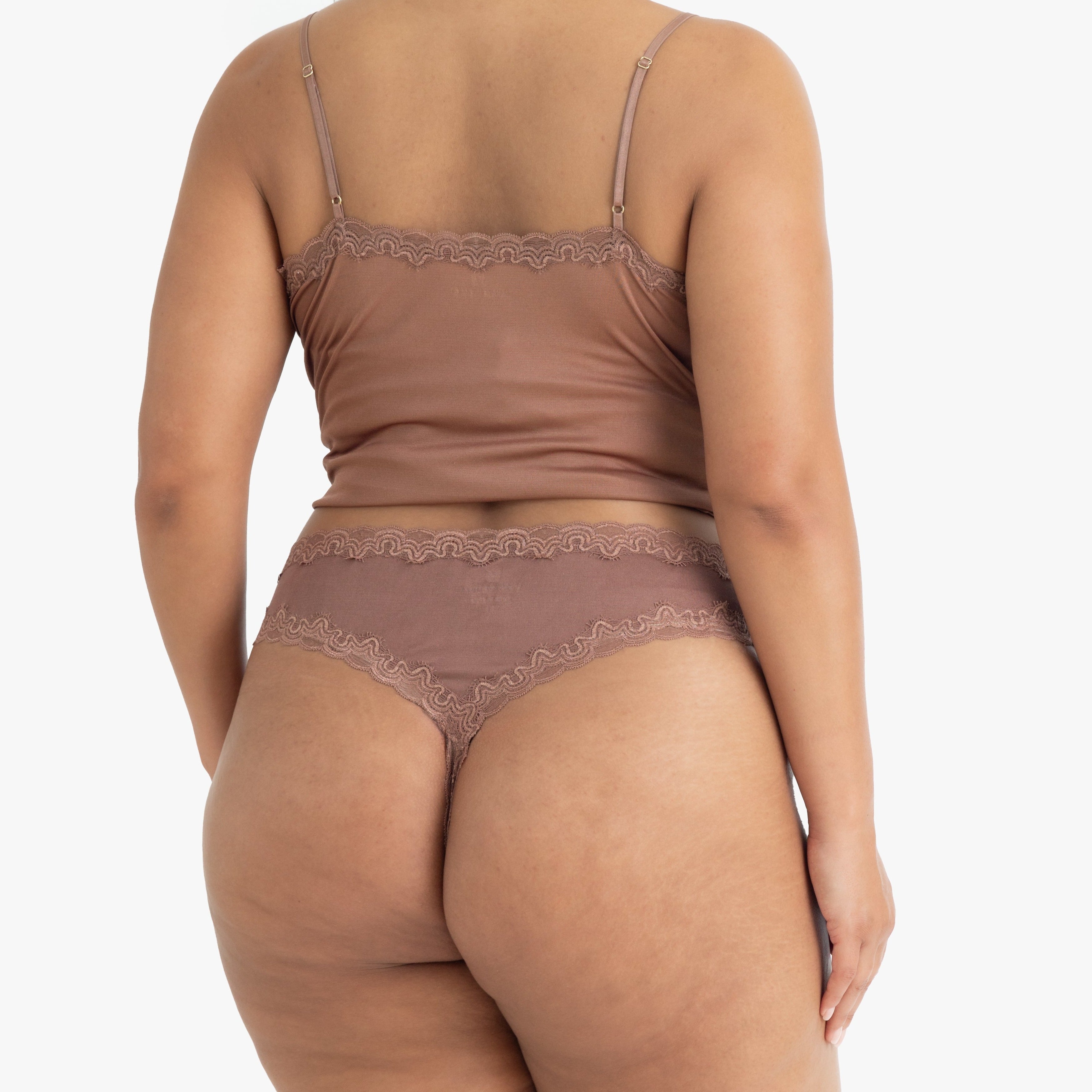 Model wearing Uwila Warrior Soft Silks Thong Underwear in Toffee on White Background