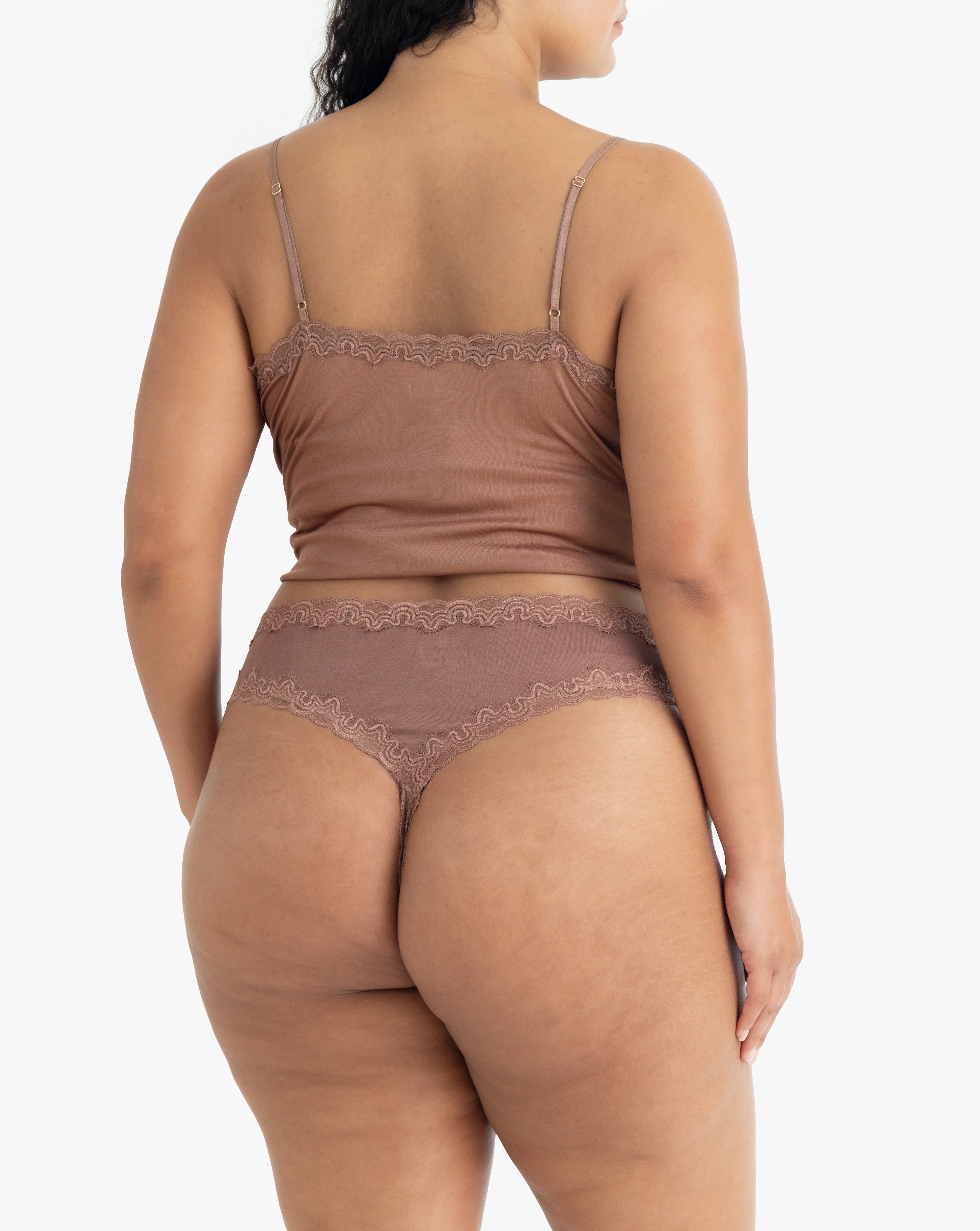 Model wearing Uwila Warrior Soft Silks Thong Underwear in Toffee on White Background