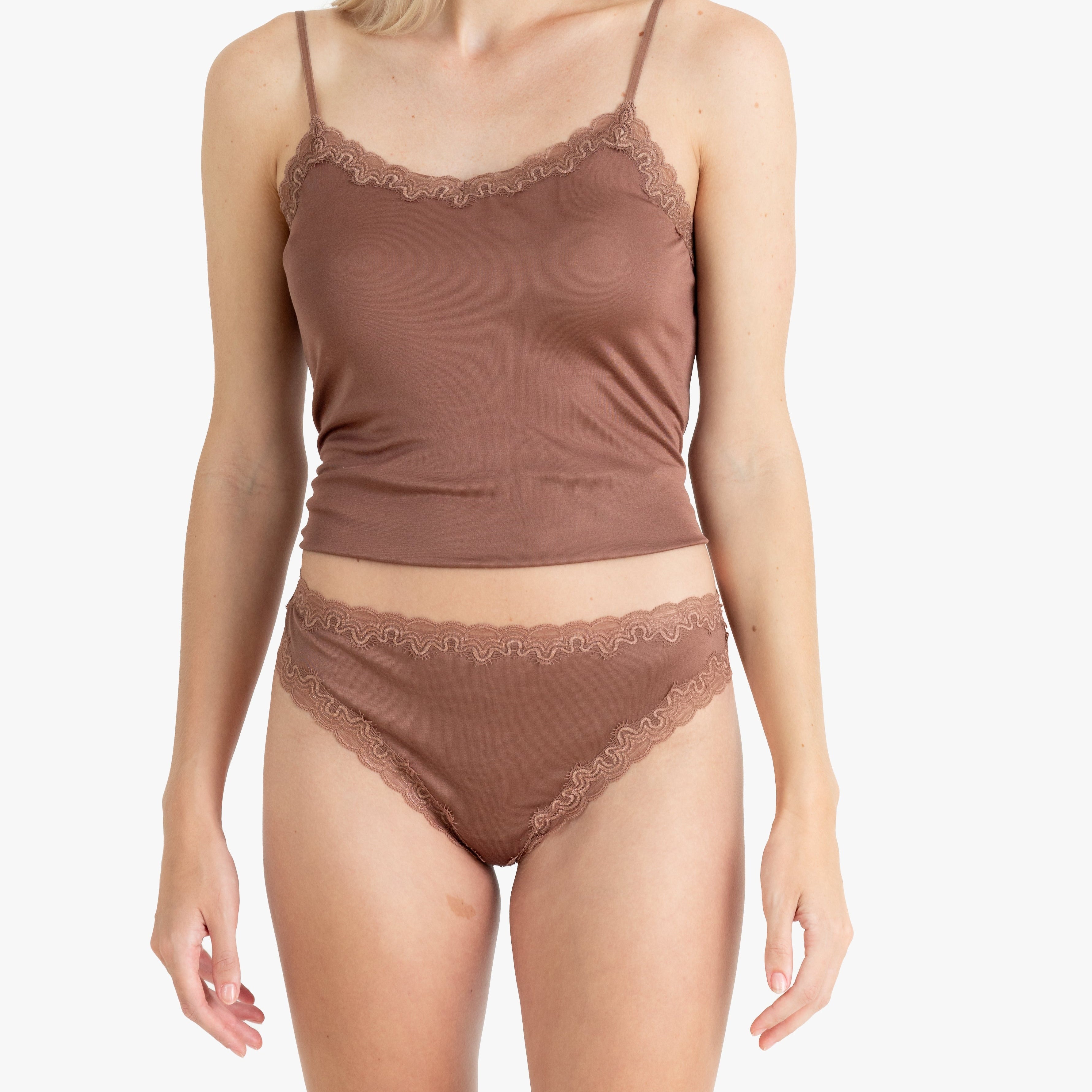 Model wearing Uwila Warrior Soft Silks Thong Underwear in Toffee on White Background