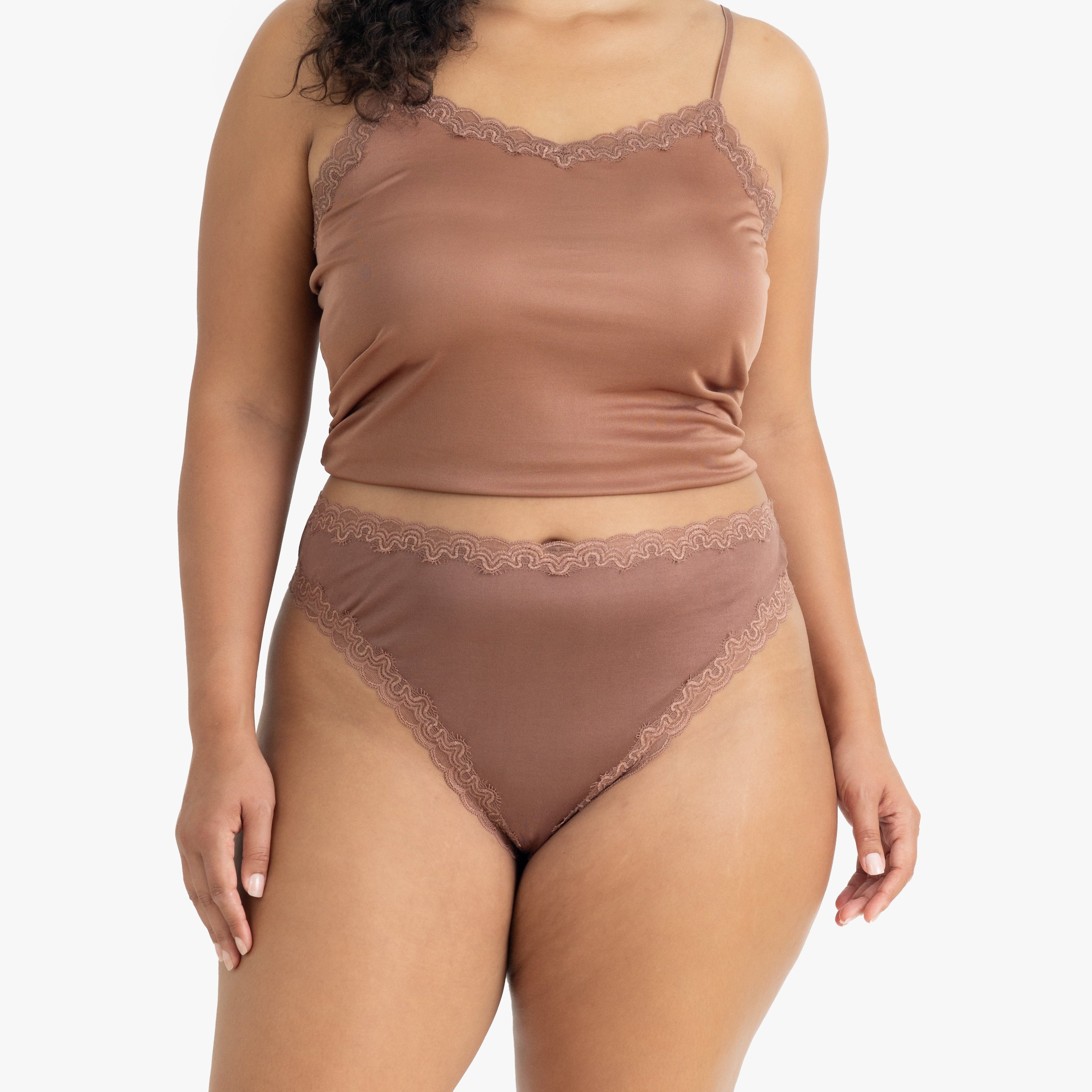 Model wearing Uwila Warrior Soft Silks Thong Underwear in Toffee on White Background