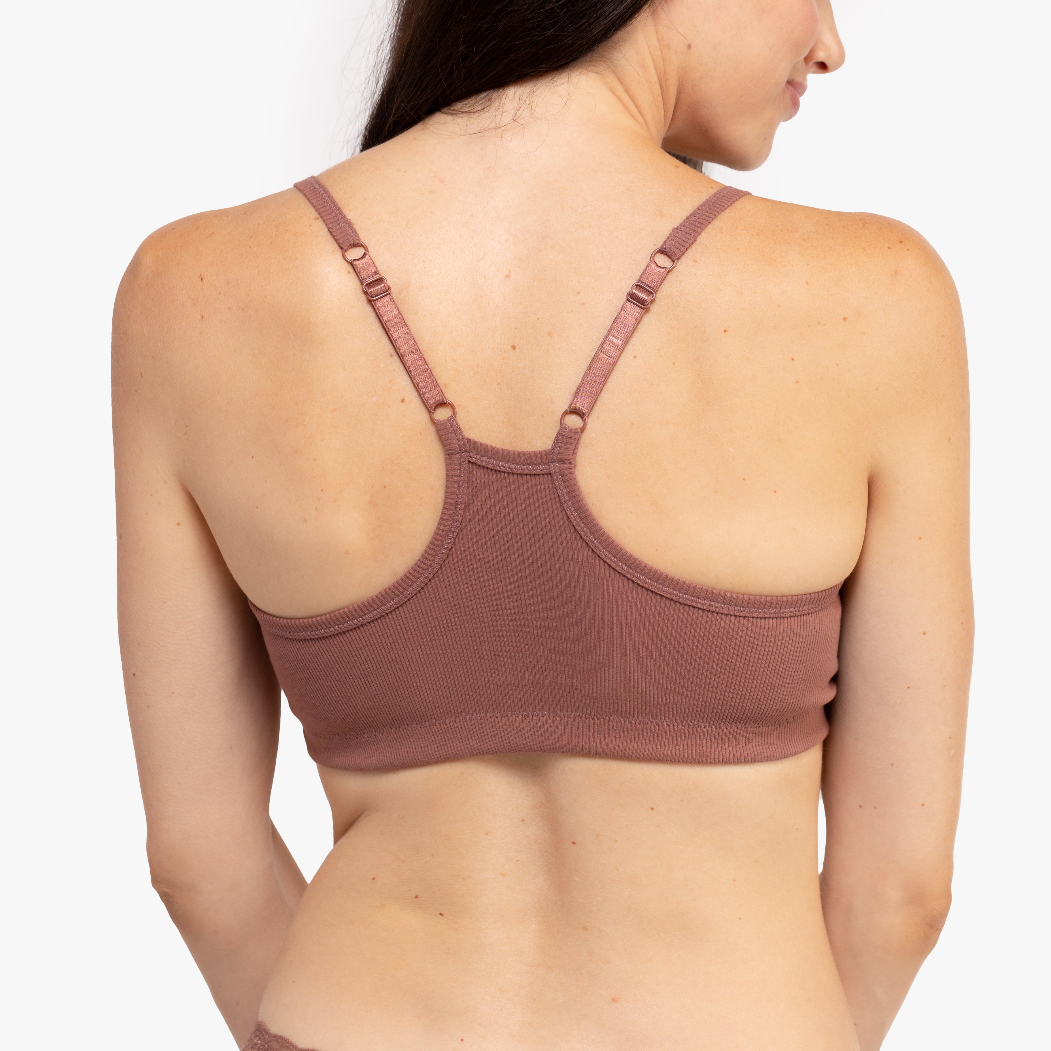 Model wearing a toffee bralette against a white background.