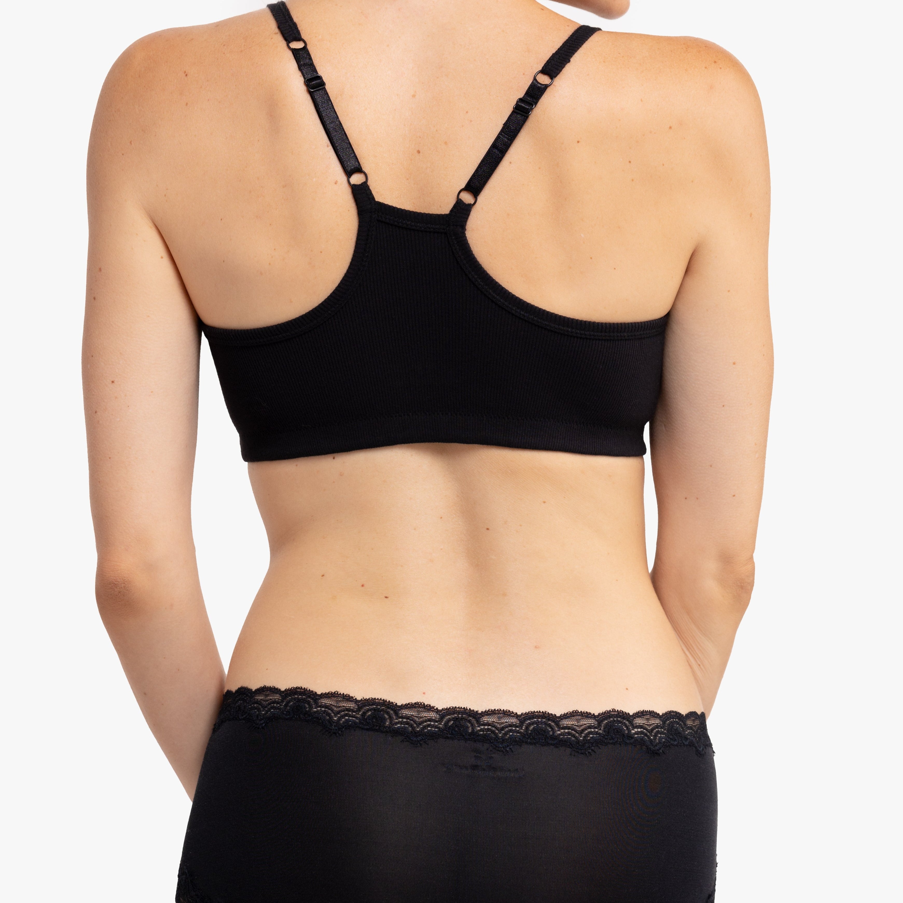Model wearing a Tap Shoe Black bralette against a white background.
