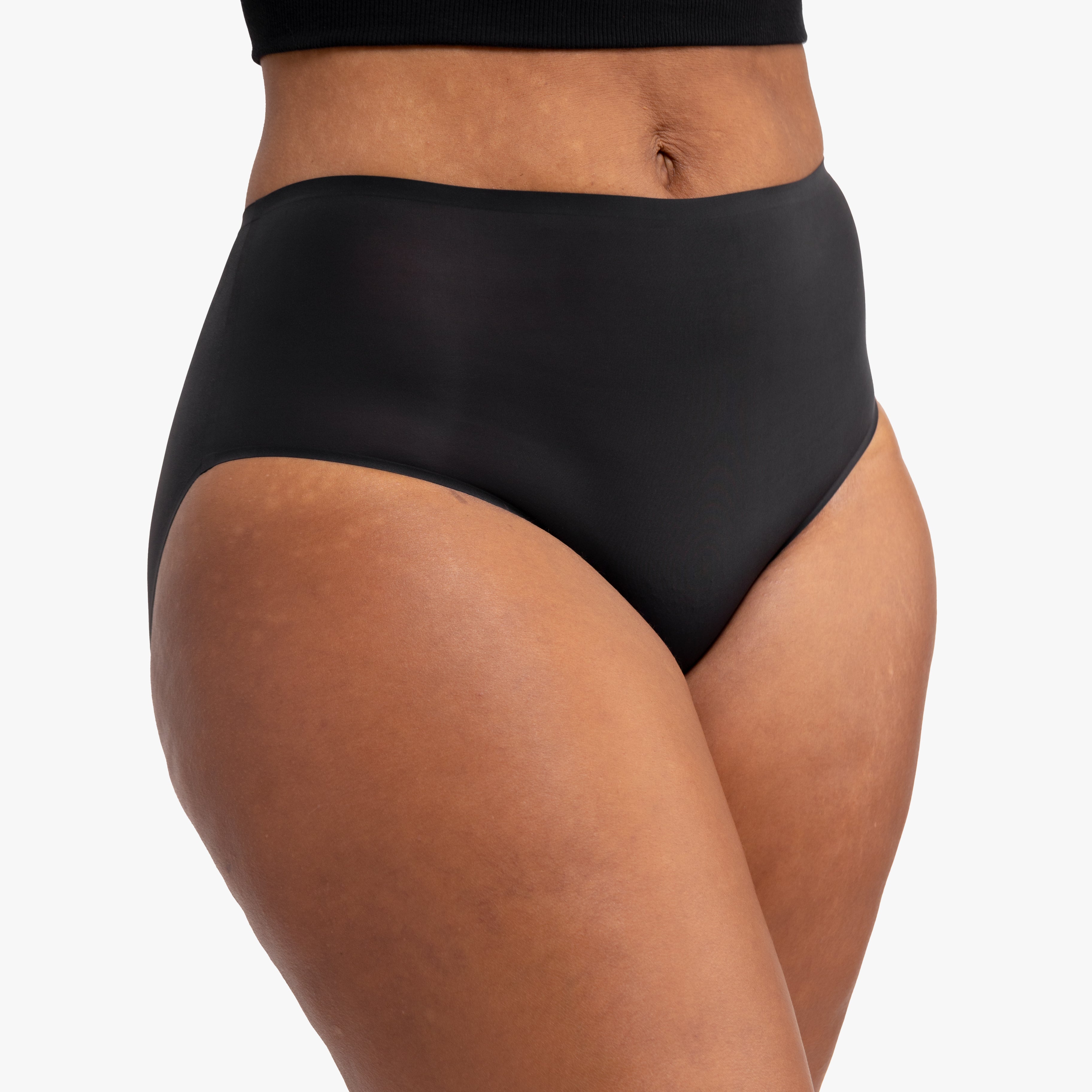 Model wearing the tap shoe black No-Brainer Brief against a white background