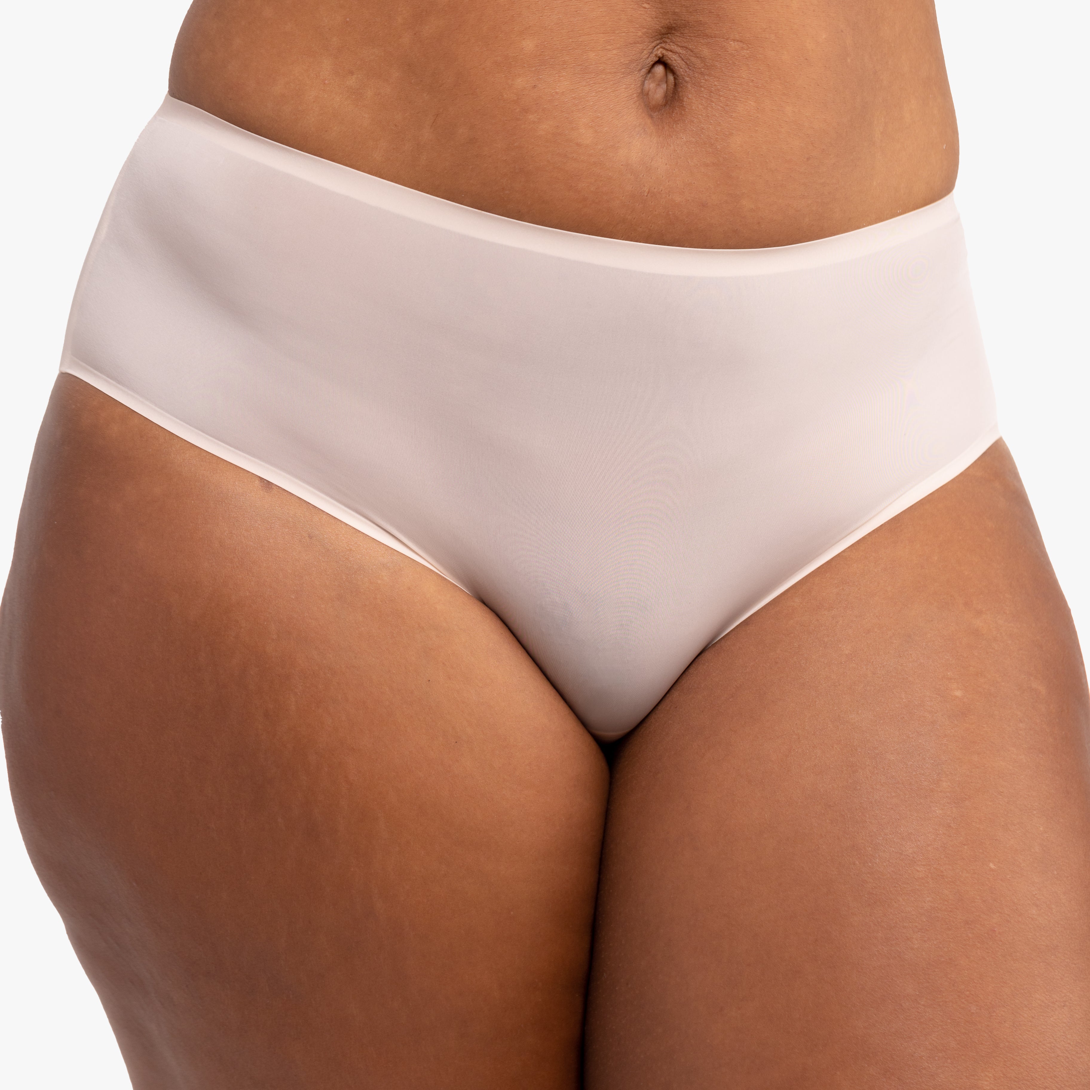 Model wearing the Almond No-Brainer Brief against a white background.