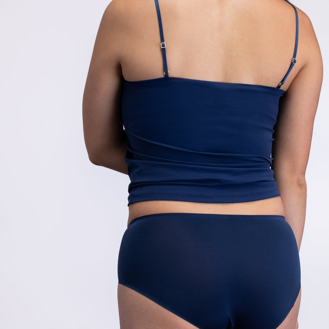 Model wearing the dress blue No-Brainer Brief against a white background