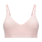 A rose quartz, underwire-free soft bra with adjustable straps and removable cup inserts on white background.