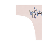 A soft seamless rose quartz thong underwear with an embroidered floral pattern in contrasting colors.