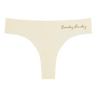A Winter White soft seamless thong with 'Sunday Funday' written in gold on the front.