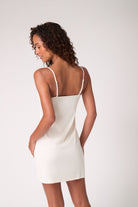 Model wearing Uwila Warrior Soft Seamless slip in Winter White. 