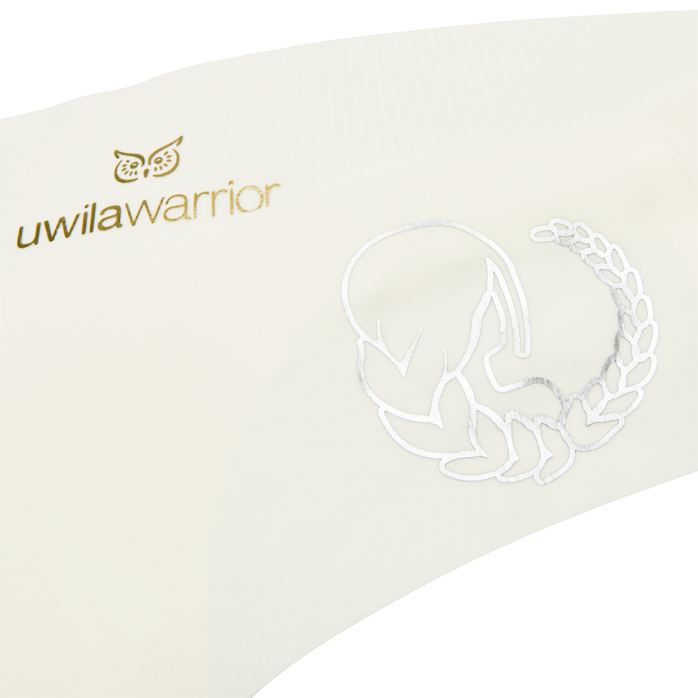 This image features a sleek, black thong with a distinctive metallic silver decal of a zodiac sign on the waistband. The thong is designed with a cotton gusset for superior hygiene and is constructed with thermowelded side seams and removable tags for comfort.
