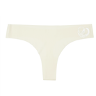 This image features a sleek, black thong with a distinctive metallic silver decal of a zodiac sign on the waistband. The thong is designed with a cotton gusset for superior hygiene and is constructed with thermowelded side seams and removable tags for comfort.