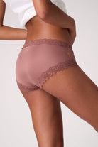 Person wearing a pair Toffee Soft Silk Briefs on a white background