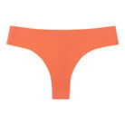 An orange soft seamless thong underwear on white background. 
