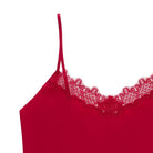 A red soft seamless camisole with delicate lace detail at the neckline, with adjustable straps.