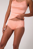 Model wearing Papaya Punch Soft Silk with Thirstday decal.