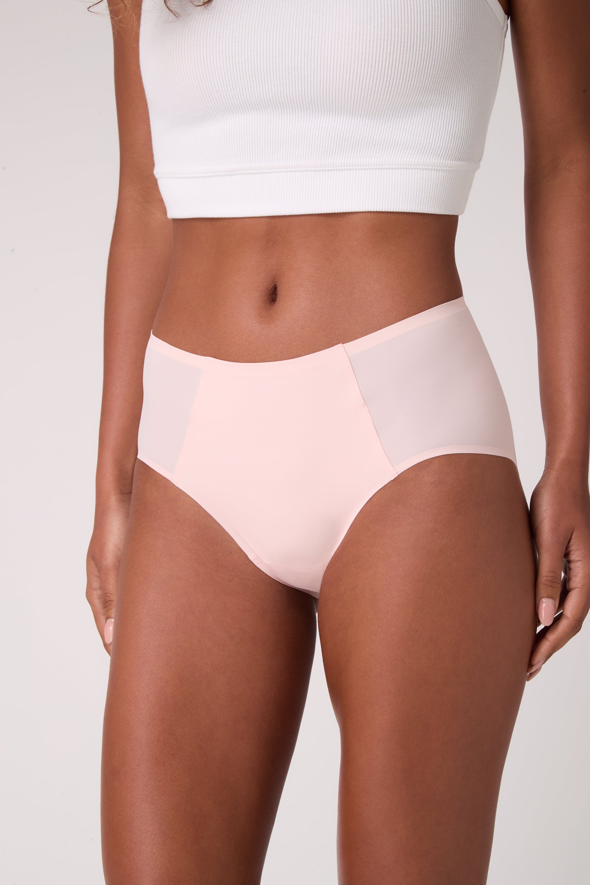 Model wearing Uwila Warrior Soft Seamless High Waisted Brief in Rose Quartz