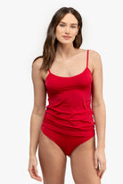 A woman wearing a jester red soft seamless thong underwear on white background.