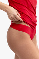 A jester red soft seamless thong underwear on white background.