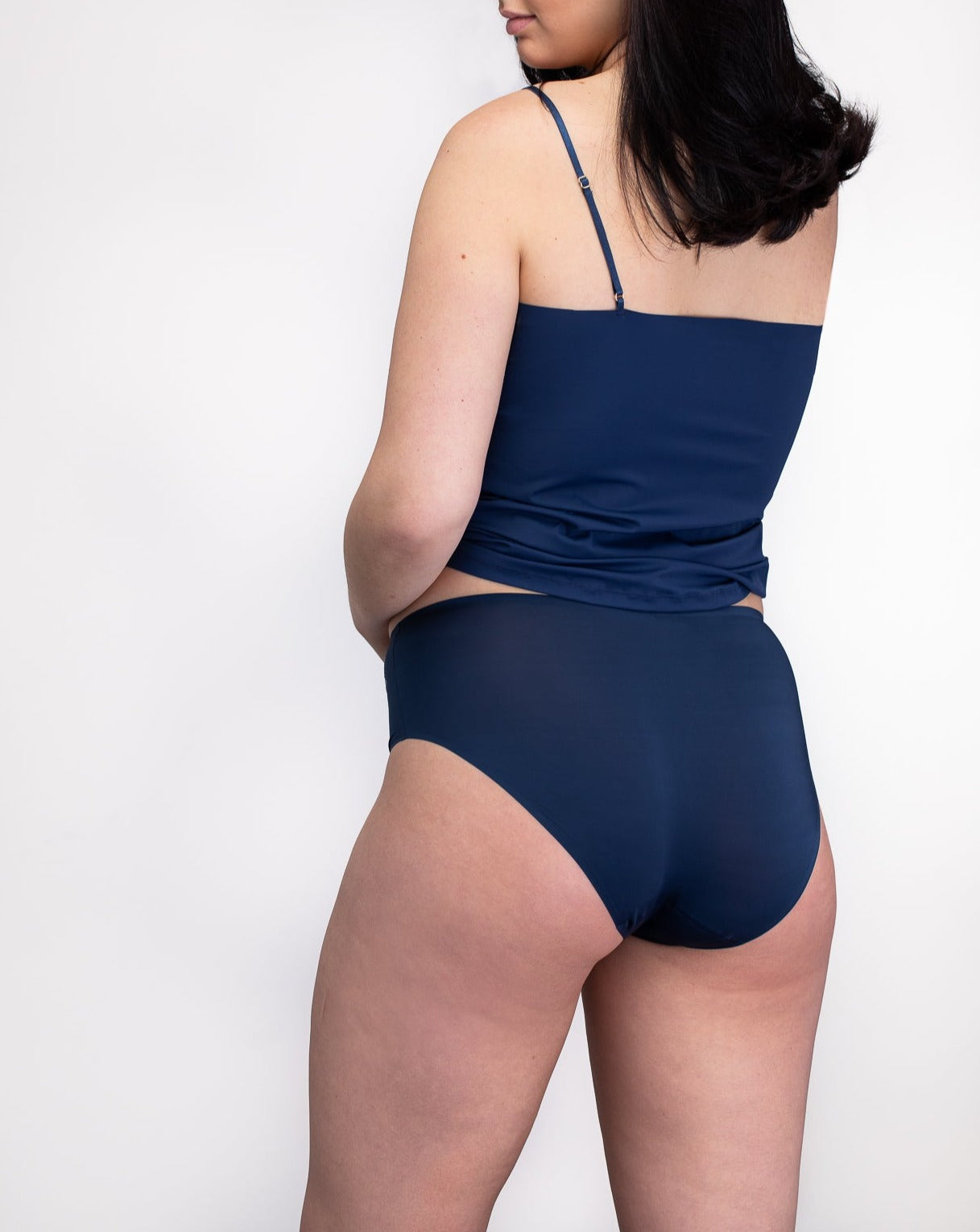 Model wearing the dress blue No-Brainer Brief against a white background