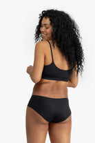 Model wearing Uwila Warrior Better Briefs Soft Bra in Tap Shoe Black on White Background