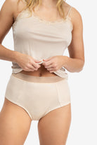 Model Wearing Uwila Warrior HIgh-Waist Silk Briefs Underwear in Smoke Grey on White Background