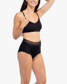 Model Wearing Uwila Warrior HIgh-Waist Silk Briefs Underwear in Tap Shoe Black on White Background