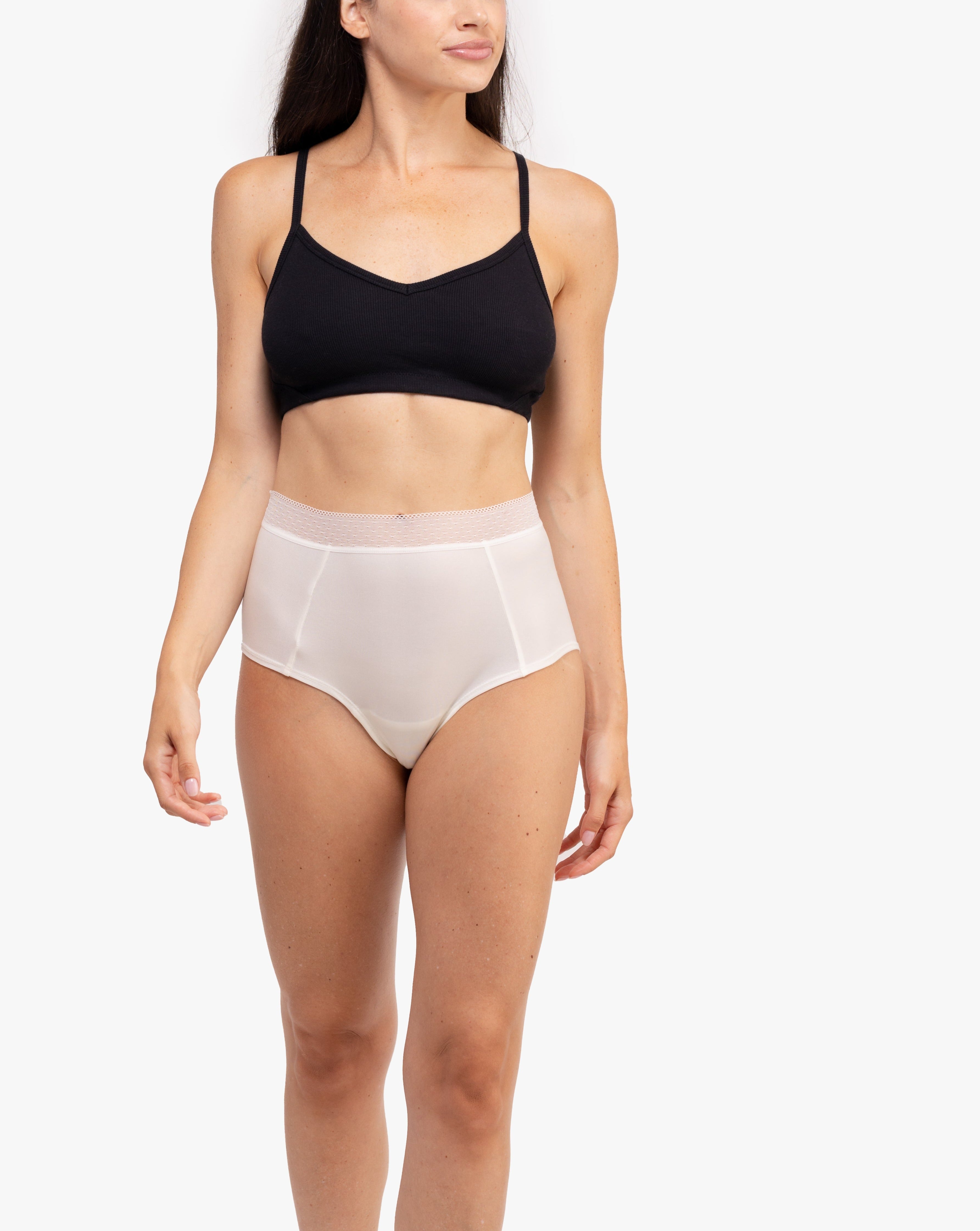 Model Wearing Uwila Warrior HIgh-Waist Silk Briefs Underwear in Winter White on White Background