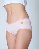 Rose Quartz Soft Silk Brief with heart logo on a plain background