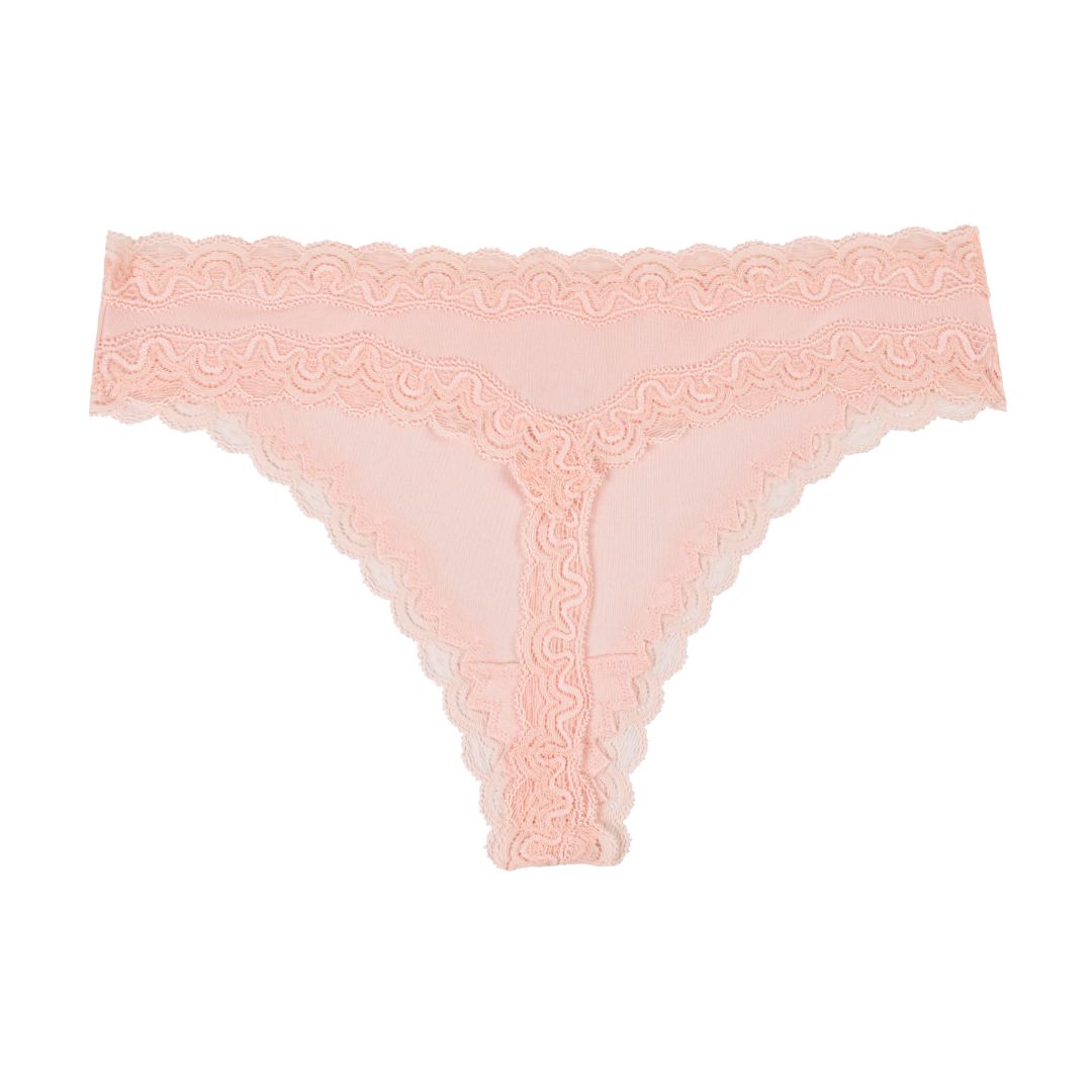 Still life of Uwila Warrior Soft Silks Thong Underwear in Rose Quartz on White Background