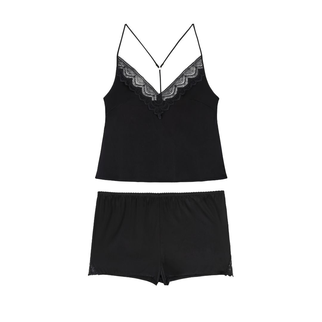 Black lace-trimmed camisole and shorts set on a white background