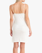 Model wearing Uwila Warrior Silk Blend Slip in Soft White on White Background